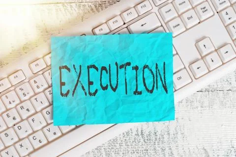 Text sign showing Execution. Conceptual photo it executes or imposes a program 写真素材