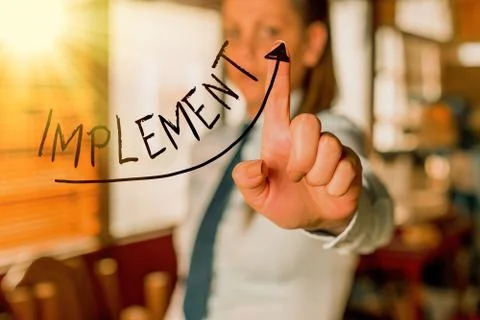 Text sign showing Implement. Conceptual photo to provide instruments or means of Foto stock