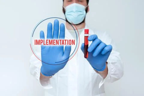 Text sign showing Implementation. Concept meaning The process of making Stock Photos