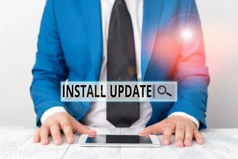 Text sign showing Install Update. Conceptual photo the act of replacing an older Stock Photos