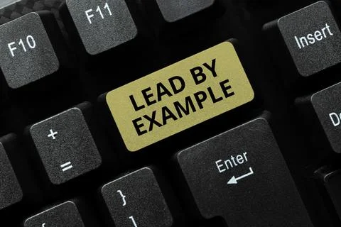 Text sign showing Lead By Example. Word Written on Be a role model by following Stock Photos