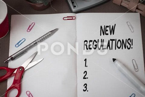 Text sign showing New Regulations. Conceptual photo rules made government order Stock Photos