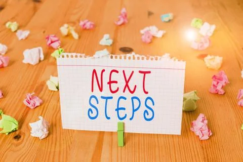 Text sign showing Next Steps. Conceptual photo something you do or plan after Stock Photos