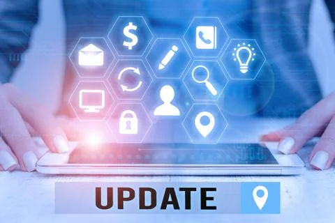 Text sign showing Update. Conceptual photo by adding new information or making Stock Photos