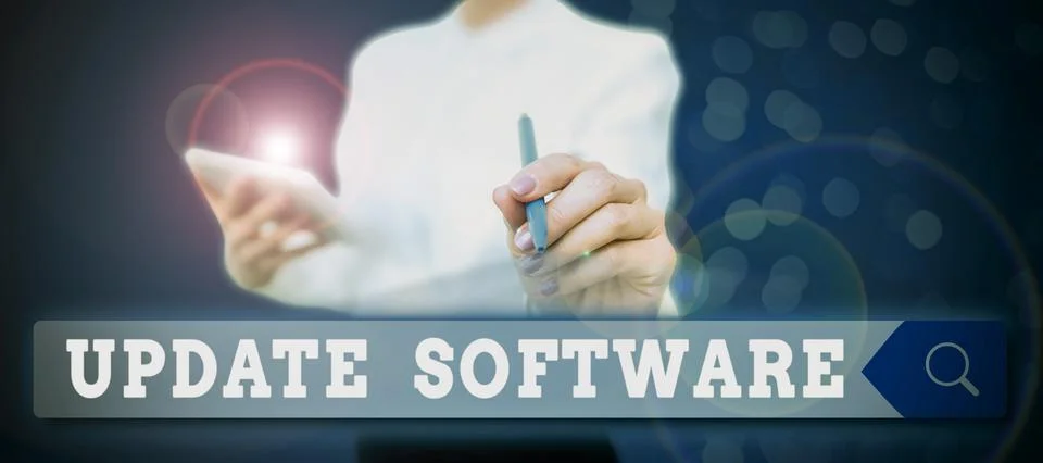 Text sign showing Update Software. Word for an application patch fixing the Stock Photos