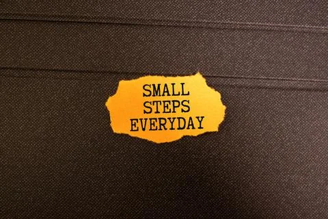 Text small steps everyday on a white background Stock Photos