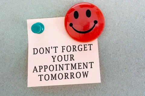 Text on sticky notes with red smile face magnet. Reminder concept Stock Photos