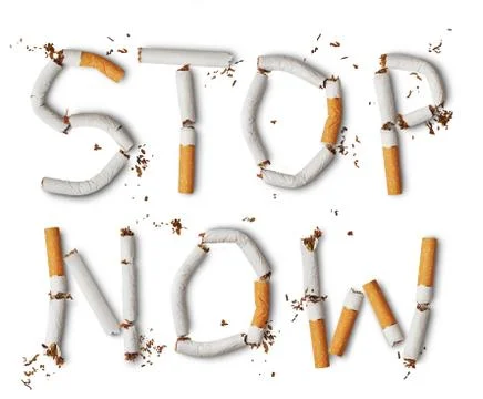 Text stop now made from broken cigarettes Stock Photos