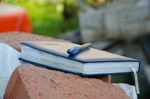 The text Study on a wooden cubes, lying on a Notepad with a metal blue pen. B Stock Photos