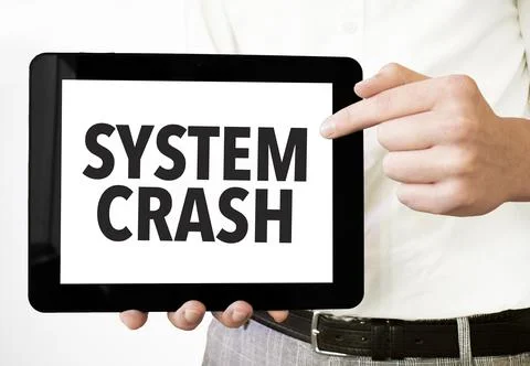 Text SYSTEM CRASH on tablet display in businessman hands on the white backg.. 스톡 사진