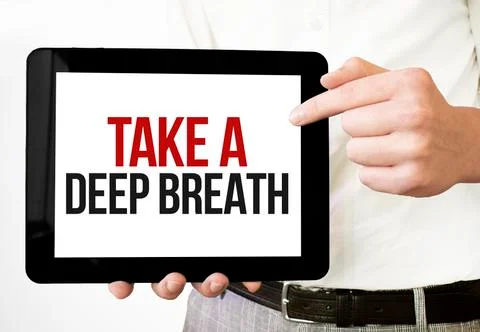 Text Take a deep breath on tablet display in businessman hands on the white b Stock Photos