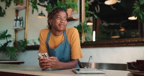 Text, thinking or black woman in cafe with phone, online gif or chat reaction on Stock Footage 330991330
