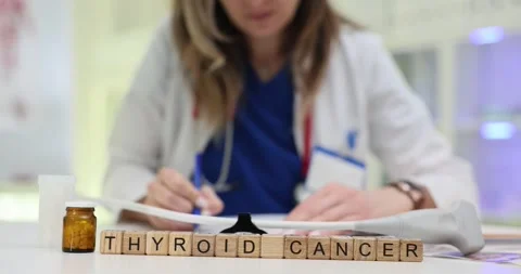 Text Thyroid Cancer on blocks and woman writes medical report Video stock 313291976