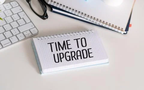 Text TIME TO UPGRADE text on sticky on keyboard, business concept. Stock Photos