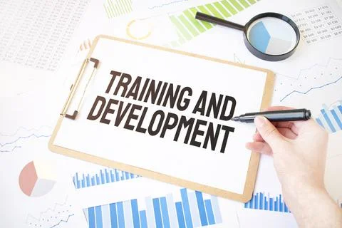 Text Training and Development on white paper sheet and marker on businessman  Stock Photos