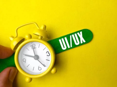 Text UI UX on yellow background. Stockfoto's