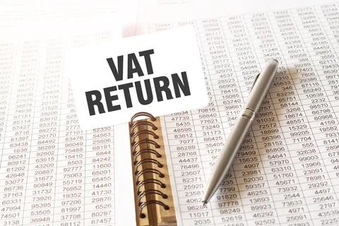 Text VAT RETURN on paper card, pen, financial documentation on table Stock Photos