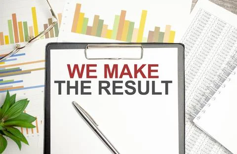 Text WE MAKE THE RESULT on file folder with charts and pen Stock Photos