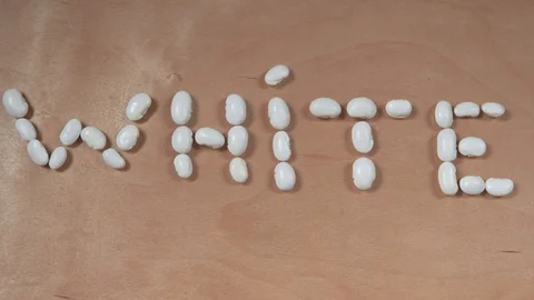 Text White From Beans On The Wooden Table Stock Footage 122608665