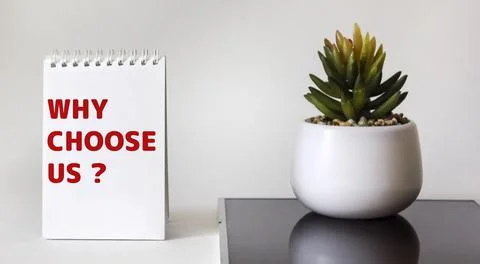 Text Why choose us Question on notepad. Business concept for a list of advant Stock Photos