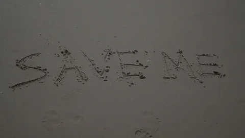 Text Words "save me" Drawn In The Sand at the beach ocean. sos help concept. Video stock 100173960