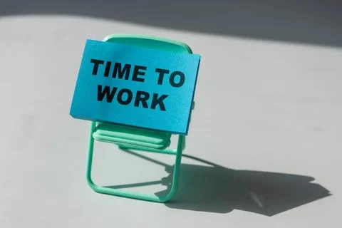 The text Work Time on a wooden blocks, lying on a Notepad with a metal blue pen. Foto stock