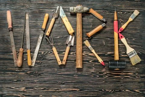 Text WORK is written by work tools. The word WORK is made up of a work tools Stock Photos