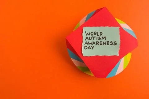 Text world autism awareness day handwritten on colorful background Stock Photos