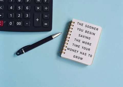 Text written on note pad with background of a pen and calculator Stock Photos