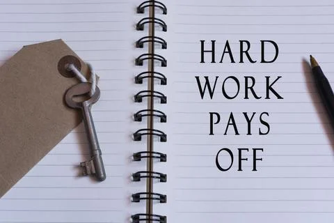 Text written on notebook with house key. Hard work concept Foto stock