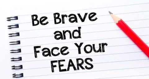 Text written on notebook page Be Brave and Face Your Fears  Stock Photos
