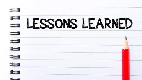 Text written on notebook page Lessons Learned Stock Photos