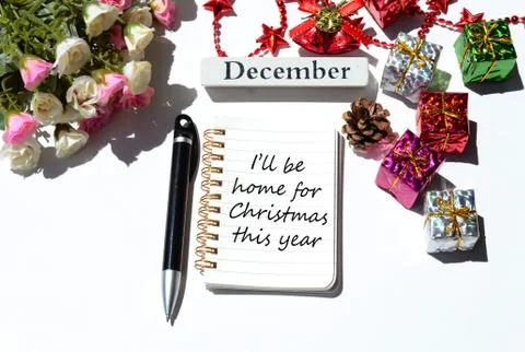Text written on notepad with christmas decorations background Stock Photos