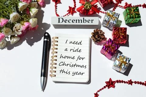 Text written on notepad with christmas decorations background Stock Photos