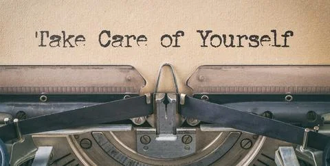 Text written with a vintage typewriter -Take Care of Yourself Fotos de archivo