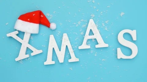 Text Xmas in red Santa hat and falling snow Stock Footage 117170252