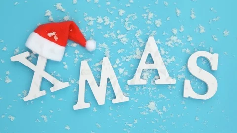 Text Xmas from volume white letters in red Santa hat and falling snow Stock Footage 120301135