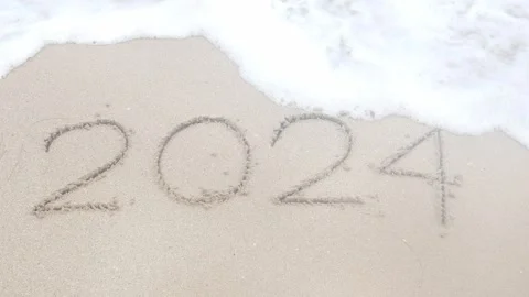 Text year 2024 from hand writing on white sand surface beach in thailand wh.. Stock Footage 277872183