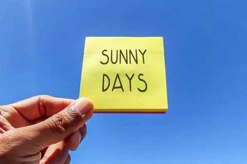 Text on yellow adhesive note with sky background. Stock Photos