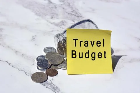 Text on yellow notepad stick on a jar with Chinese yuan coin on the table Stock Photos