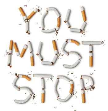 Text ''you must stop'' made from broken cigarettes Stock Photos