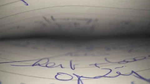 Textbook hand written blue text macro closeup Stock Footage 124018076