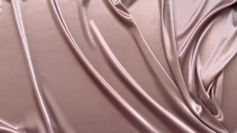 Textile abstract background of twisted light pink satin fabric Stock Footage 306561048