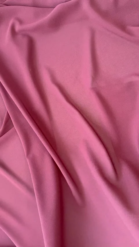 Textile abstract background of twisted pink silk fabric Stock Footage 306561044