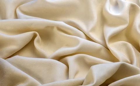 Textile and texture concept - close-up of crumpled fabric background. View from Stock Photos