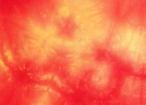 Textile background - batik in red and yellow Stock Photos