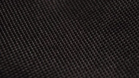 Textile background - black polyester fabric. Slider macro Stock Footage 153800645