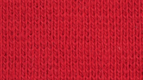 Textile background - deep red cotton elastane stretchy fabric. Macro shoot. Stock Footage 124728923