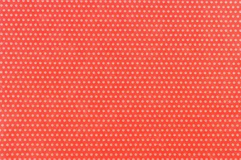 Textile background, red with a print in white polka dots. Foto stock