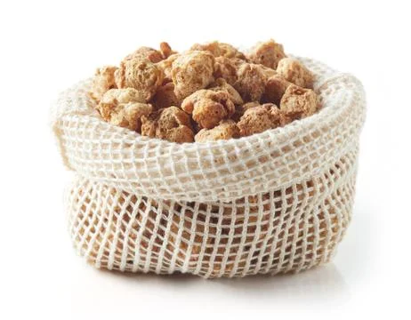 Textile bag of soya chunks isolated on white Stock Photos